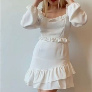 Beautiful white long sleeve dress. Perfect for any occasion. Square neck line.